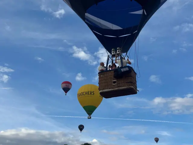 Several hot air balloons in the sky