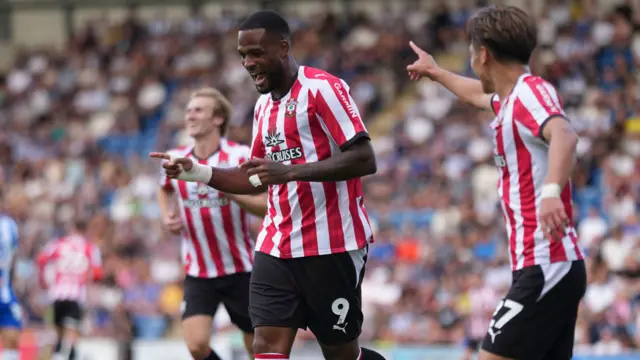 Cyle Larin celebrates scoring