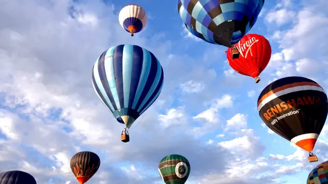 Hot air balloons in the sky in different colours