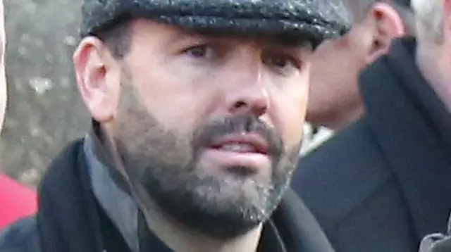 Daniel Kinahan is pictured wearing a flat cap with dark facial stubble.