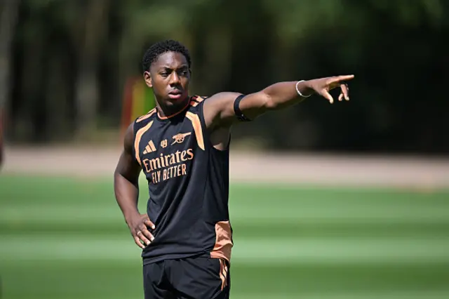 Myles Lewis-Skelly of Arsenal looks on