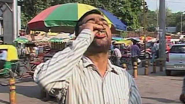 A man using chewing tobacco