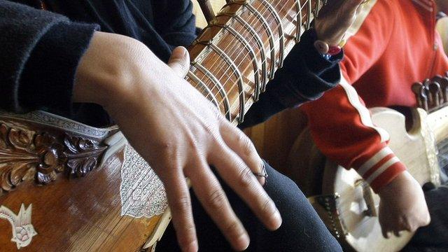 BOY PLAYING GUITAR