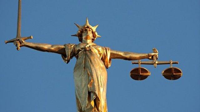 The figure of Lady Justice, at the top of the dome of the Central Criminal Court, London