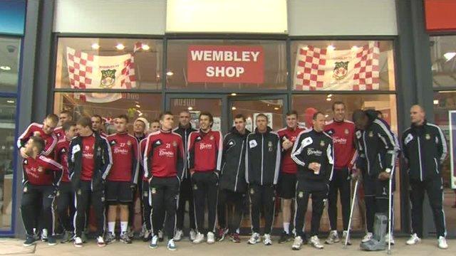 Wrexham players outside the temporary club shop