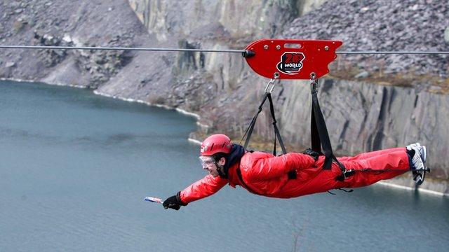 A man on a zip wire