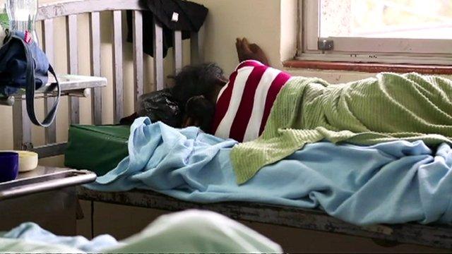 A woman lying in a post-abortion ward of a Kenyan hospital