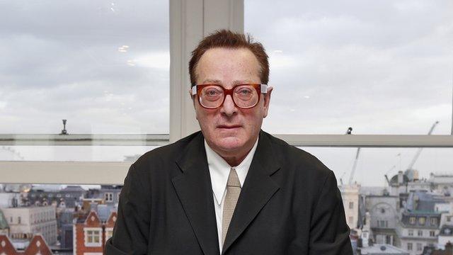 Lord Maurice Saatchi poses for photos at his office