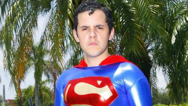 Hispanic man dressed as Superman