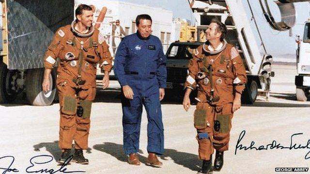 George Abbey with crew members of a space shuttle