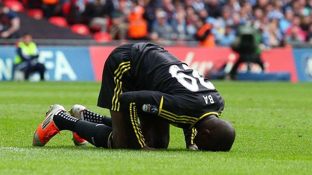 Demba Ba prays after scoring