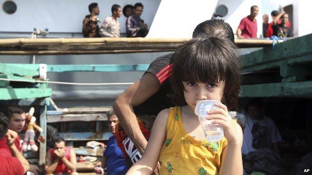 An Iranian boy on a boat intercepted in Indonesian waters while sailing to Australia