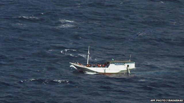 A boat carrying asylum seekers spotted off Indonesia sailing towards Australian waters