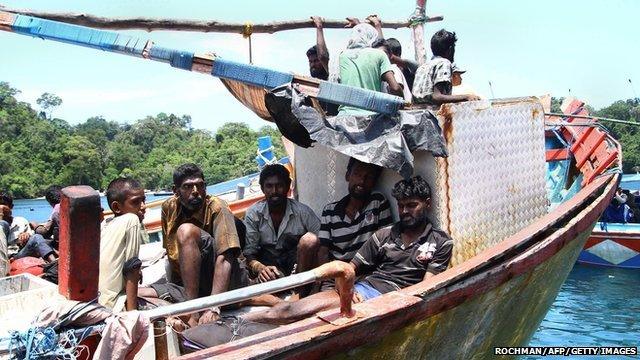 Sri Lankan asylum seekers in Indonesia rest after being rescued by local fishermen