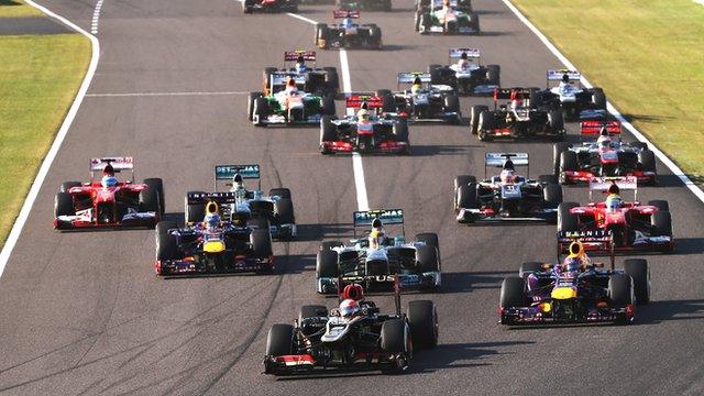 Romain Grosjean leads at the start of the 2013 Japanese Grand Prix