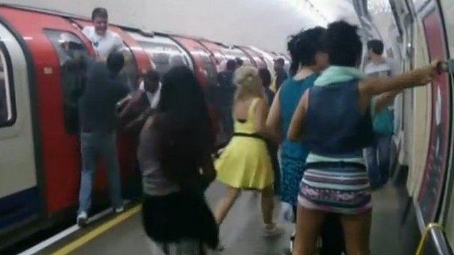 Passengers at Holland Park station during the evacuation