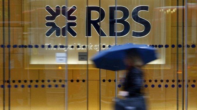 Woman walking past RBS HQ