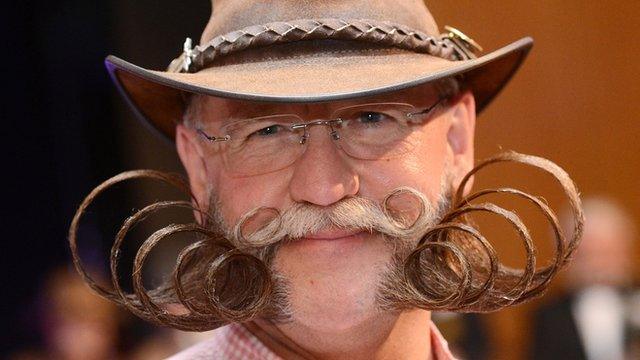 Dieter Besuch from Germany poses after winning the Partial Beard Freestyle category during the World Beard Championships