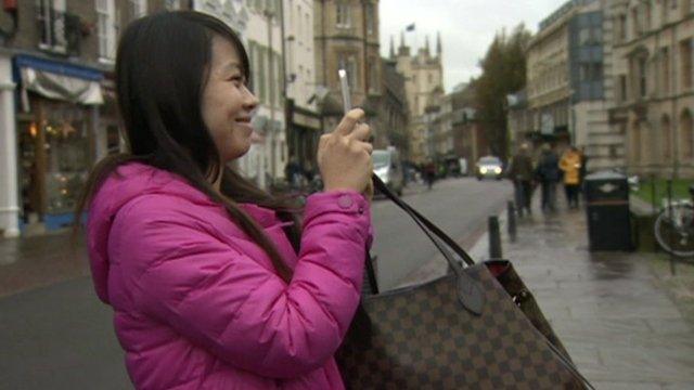 Chinese tourist taking a photo