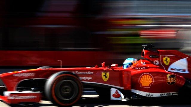 Fernando Alonso heads Jenson Button in a delayed first practice session for the US Grand Prix