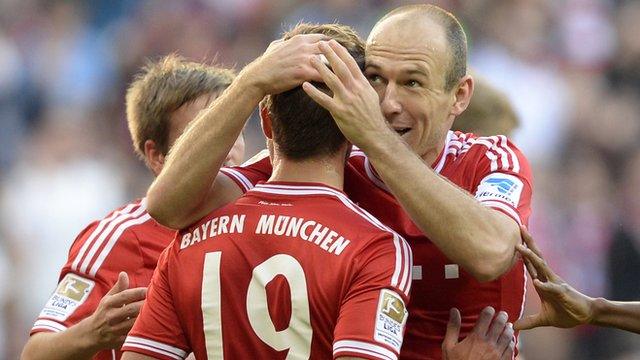 Arjen Robben hugs Bayern Munich team-mate Mario Gotze