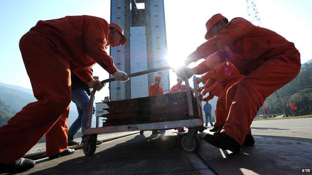 Workers make final preparations for China's first lunar rover mission.