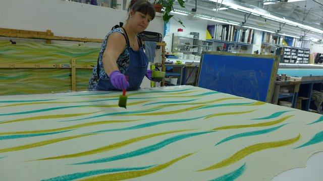 woman painting fabric