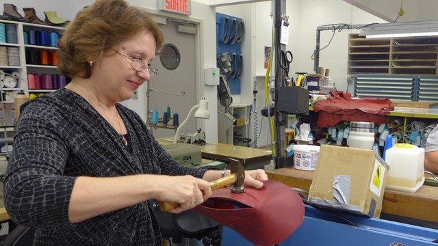 Cobbler making shoe