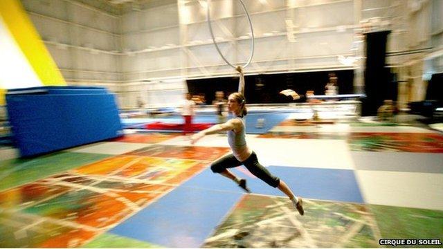 An acrobat trains at Cirque du Soleil's cavernous headquarters in Montreal