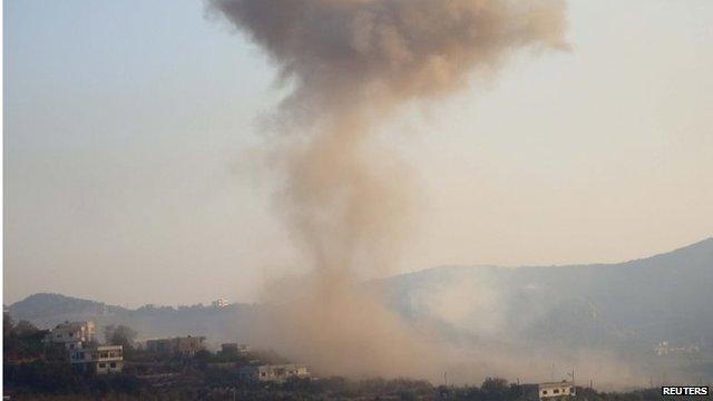 Smoke rises after reported air raid on Salma, Latakia (file photo)