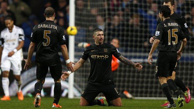 Manchester City's Aleksandar Kolarov celebrates his superb individual goal against Swansea City