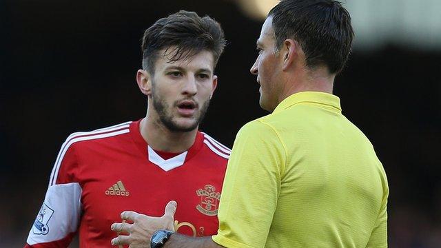 Referee Mark Clattenburg talks to Southampton's Adama Lallana during Everton's 2-1 win over the Saints