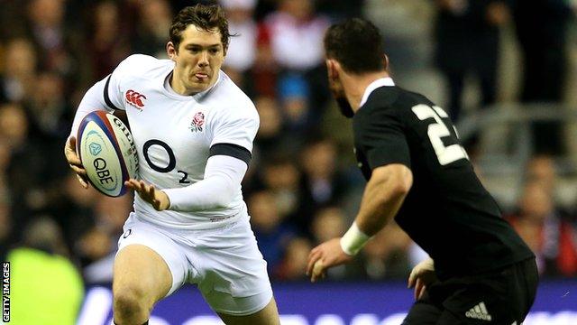 Alex Goode takes on New Zealand's Ryan Crotty