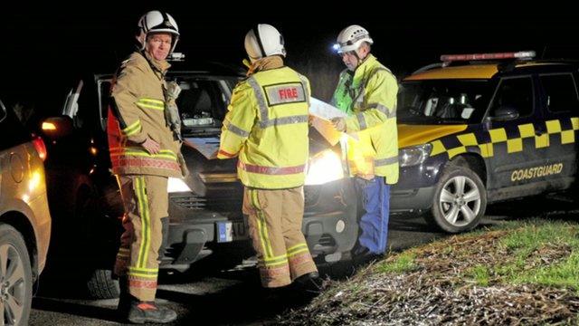 Emergency services attend the site of a helicopter crash in Cley next the Sea in north Norfolk