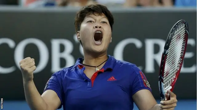 Luksika Kumkhum of Thailand celebrates defeating Petra Kvitova
