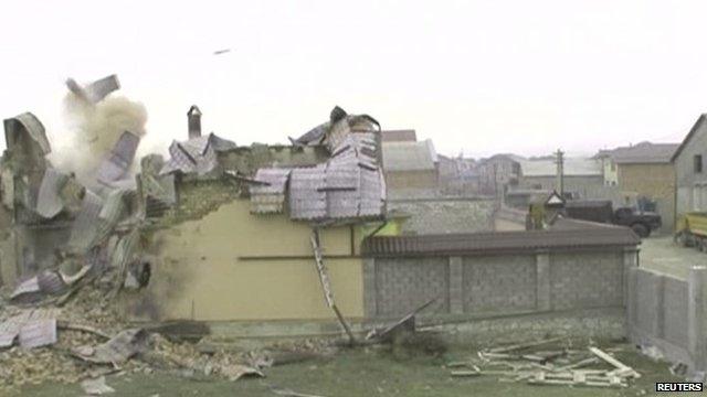 A still image from a handout video shows a building destroyed during an anti-terrorism operation in Dagestan, January 18