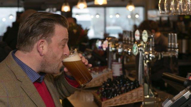 Drinker at UK first motorway service area pub