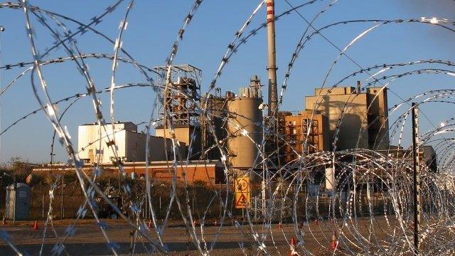 Barbed wire at the entrance to Lonmin's platinum mine in Marikana