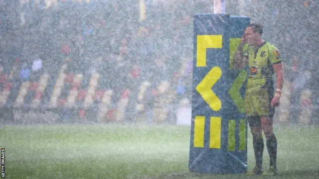 Northampton Saints' James Davis during a downpour at Rodney Parade