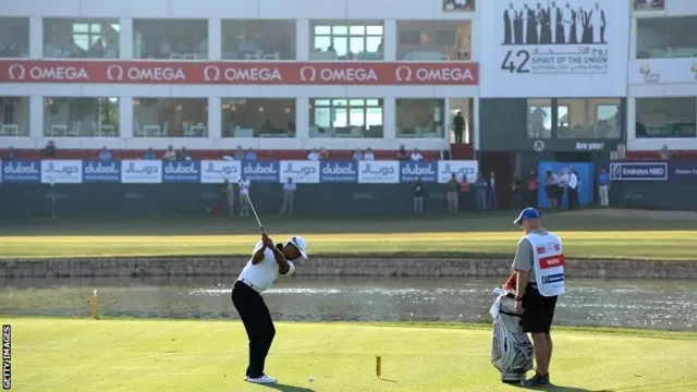 Tiger Woods in action on the 18th at the Emirates Golf Club