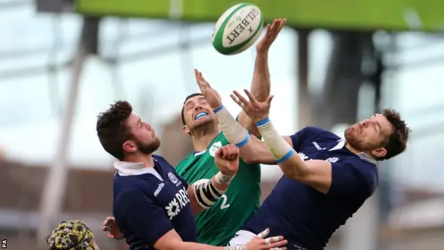 Rob Kearney challenges for a high kick