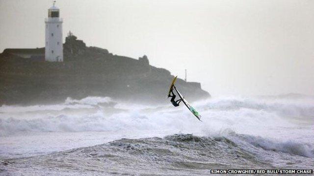 Professional windsurfer in Gwithian, in Cornwall,