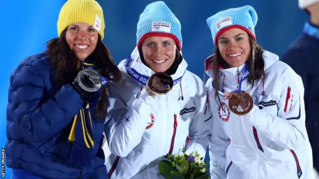 Silver medallist Charlotte Kalla of Sweden, gold medallist Marit Bjoergen of Norway and bronze medallist Heidi Weng of Norway