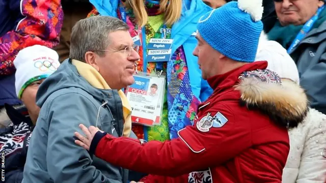 Russian Prime Minister Dmitry Medvedev (right) speaks with International Olympic Committee (IOC) president Thomas Bach