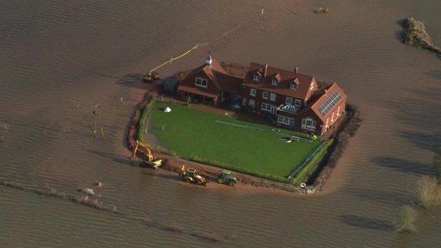 House surrounded by floodwater in the Somerset Levels