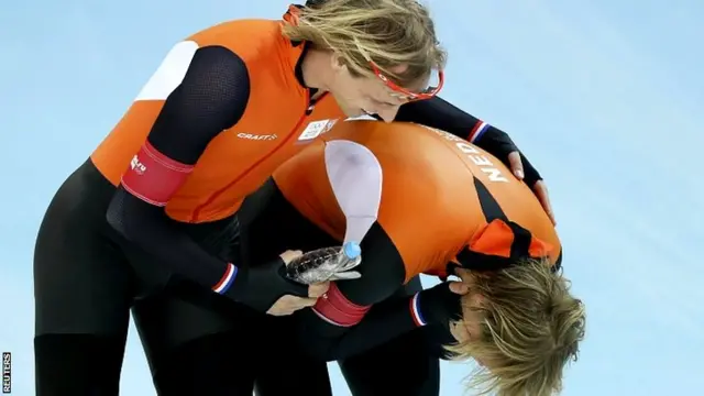 Winner Michel Mulder of the Netherlands (r) is congratulated by his twin brother Ronald