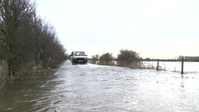 The Hook family drive through flooded fields