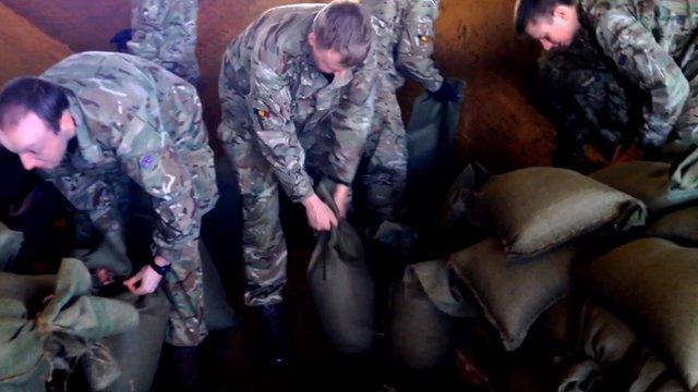 Soldiers from the 10 Training Battalion, Bordon Garrison, filling sandbags in Wraysbury