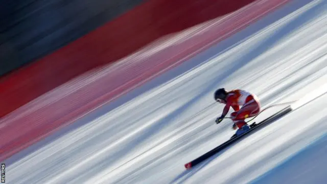 Switzerland"s Fabienne Suter speeds down the course during the women"s alpine skiing downhill race at the 2014 Sochi Winter Olympics