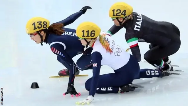 Elise Christie of Great Britain falls and collides with Seung-Hi Park of South Korea and Arianna Fontana of Italy